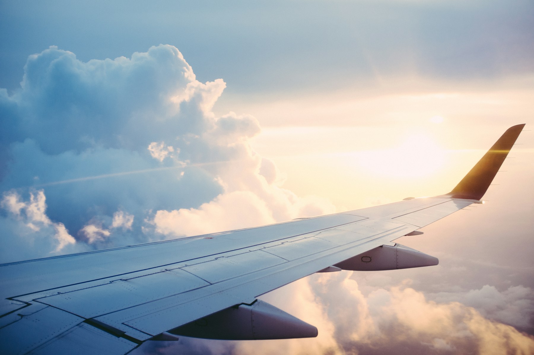 Passenger airplane flying above clouds